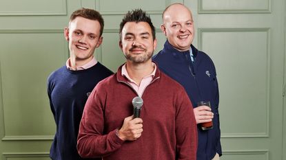 Three Cookie Jar Golf members pose for a photo holding a microphone