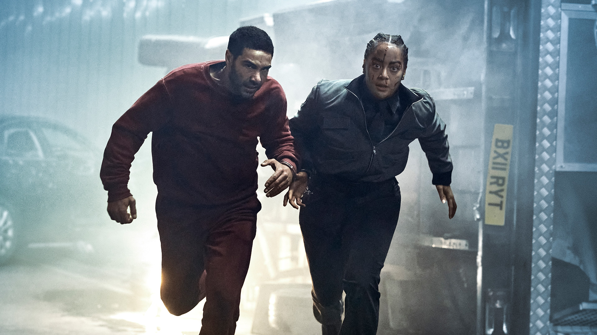 Actors Tahar Rahim and Izuka Hoyle run through a chaotic scene in Prisoner TV action thriller on Sky Atlantic