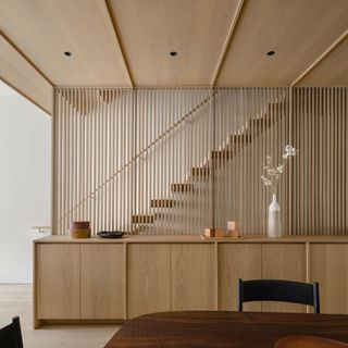 modern staircase with slatted walls