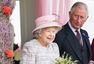 The late Queen Elizabeth II sat next to her son King Charles I in 2017