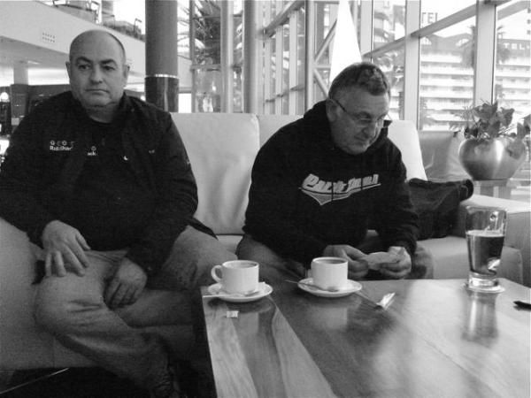 How interesting: Team mechanics Geoff Brown and Alan Buttler relaxing for a bit