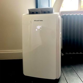 The Russell Hobbs RHPAC11001 Portable Air Conditioner with the room temperature illuminated on its front panel