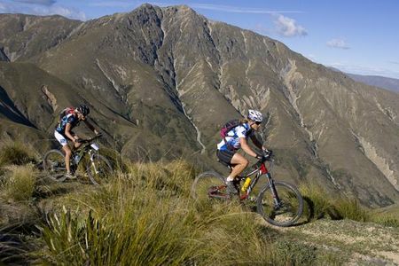 Wanaka residents Jo Williamsand Floortje Draisma ride past Mt Peel in stage 3 of the 2010 Alpine Epic. The pair were part of a three-way battle in the women's teams race that saw the girls take top-ten places in the stage overall.