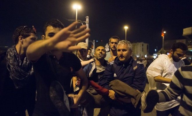  A wounded man is taken away during clashes with Turkish police on June 3 in Istanbul.