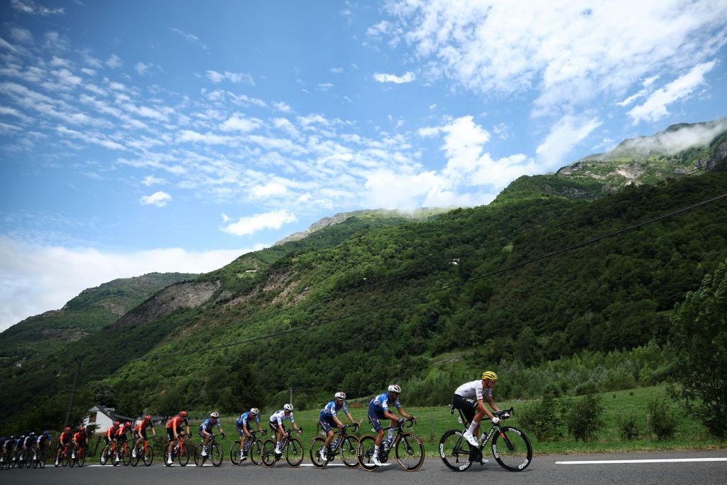UAE Team Emirates team's German rider Nils Politt leads the pack of riders (peloton) in the ascent of Col du Tourmalet during the 14th stage of the 111th edition of the Tour de France cycling race, 151,9 km between Pau and Saint-Lary-Soulan Pla d'Adet, in the Pyrenees mountains in southwestern France, on July 13, 2024. (Photo by Anne-Christine POUJOULAT / AFP)
