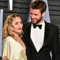 Miley Cyrus and Liam Hemsworth attend the 2018 Vanity Fair Oscar Party