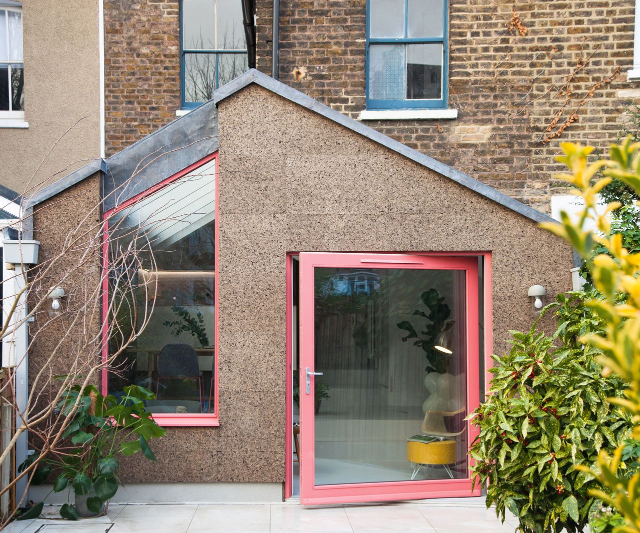 Environmentally friendly cork clads this unique extension to a modest Victorian terraced house in south London