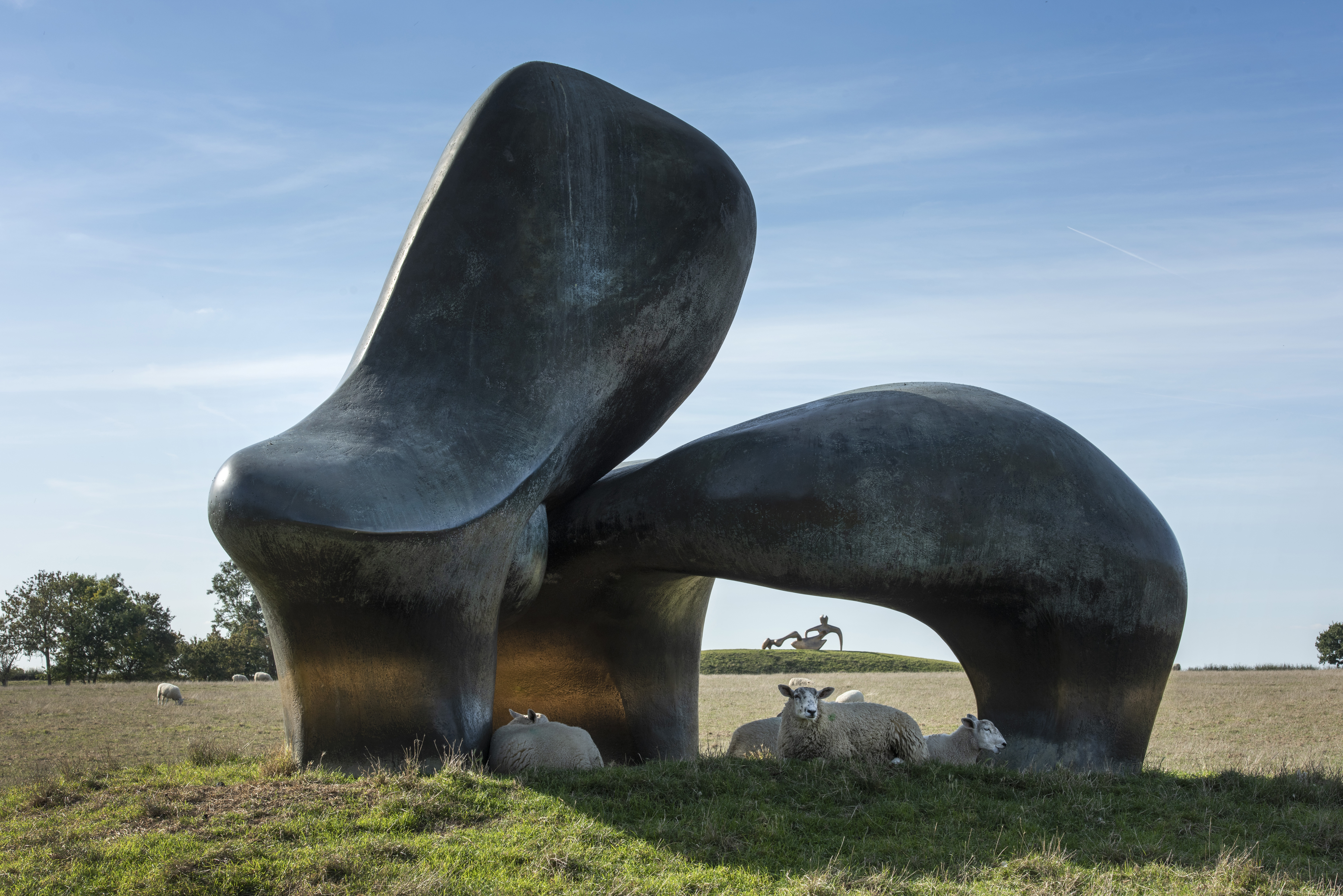 Henry Moore, Sheep Piece, with sheep sat underneath