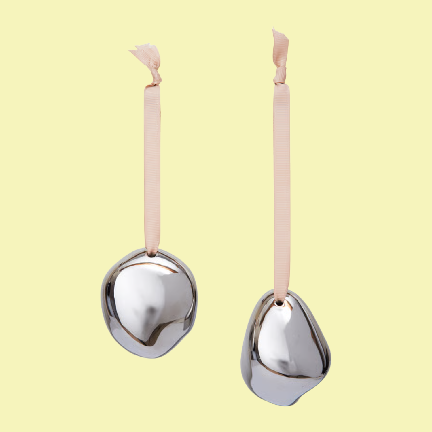 A set of silver ornaments with pink ribbons