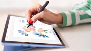 Hand drawing flowers on Microsoft Surface Pro 9 using stylus