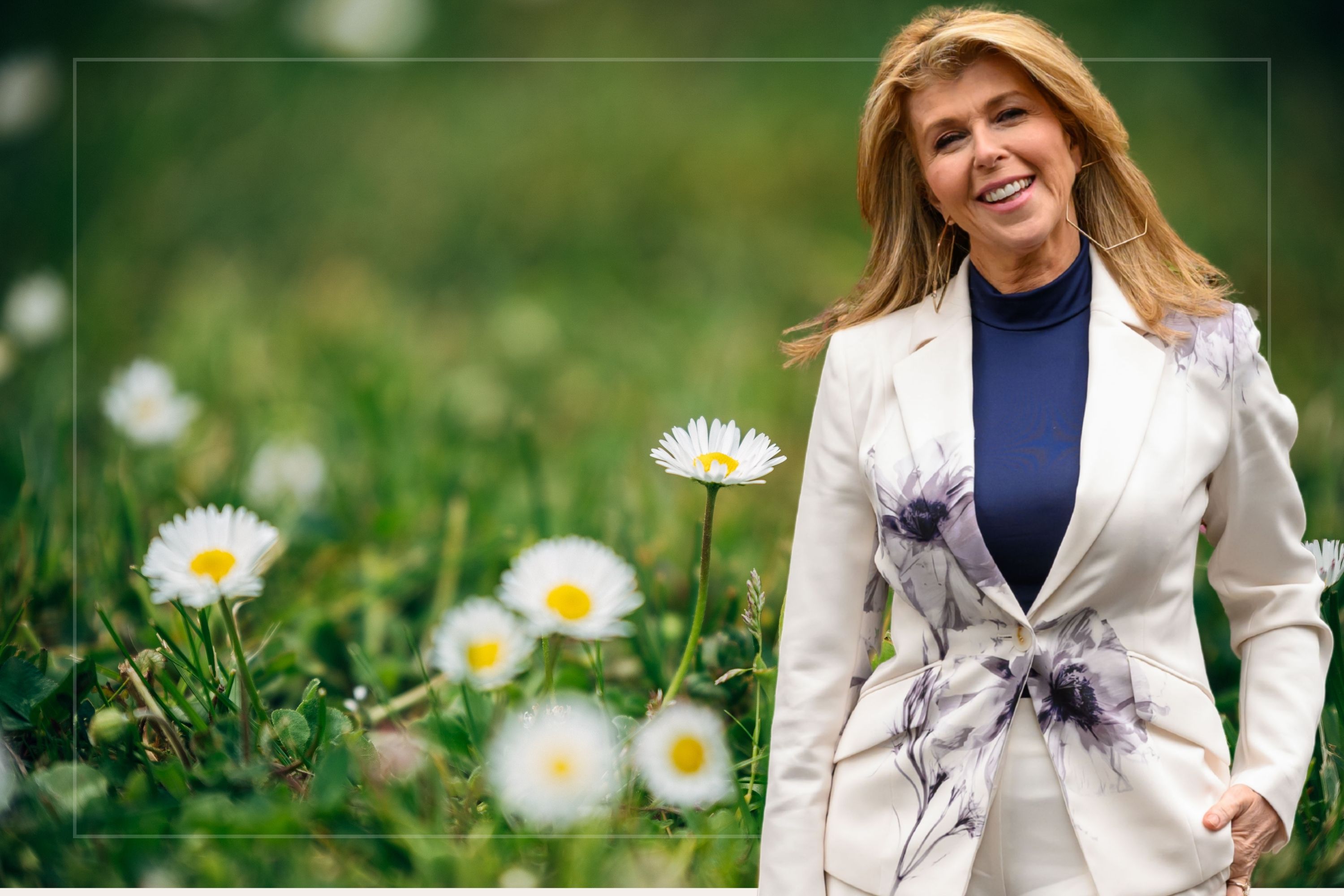 An image of Kate Garraway against a backdrop of daisies and weeds
