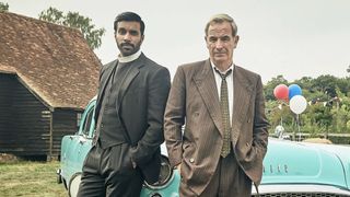 Alphy and Geordie standing together with hands in pockets in Grantchester Season 11