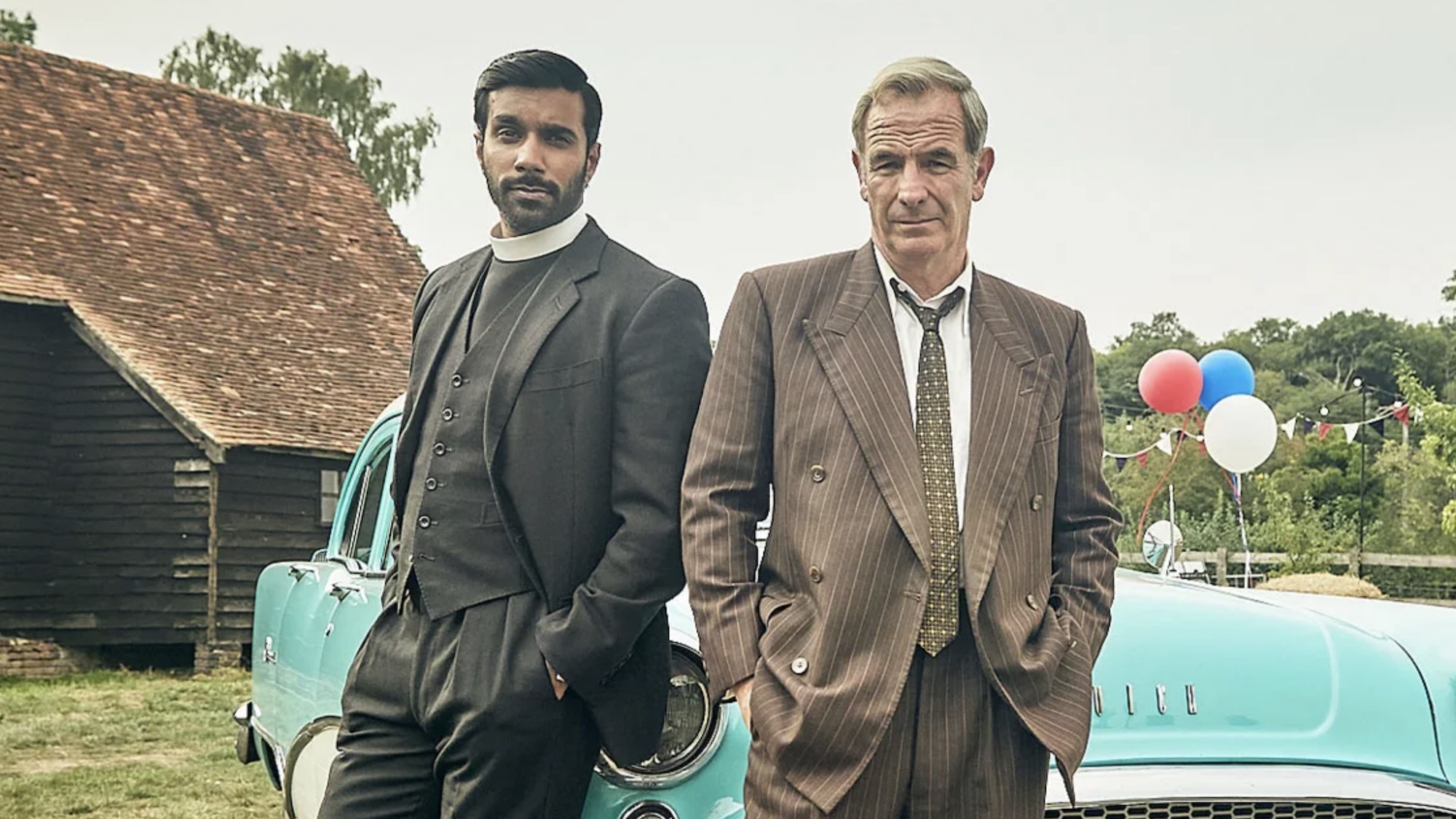 Alphy and Geordie standing together with hands in pockets in Grantchester Season 11