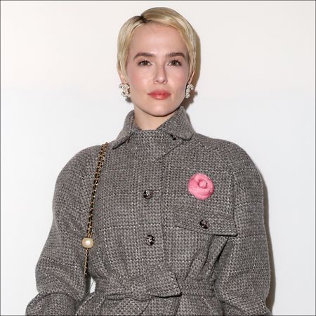 Zoey Deutch attends the Chanel show with a platinum blonde pixie cut