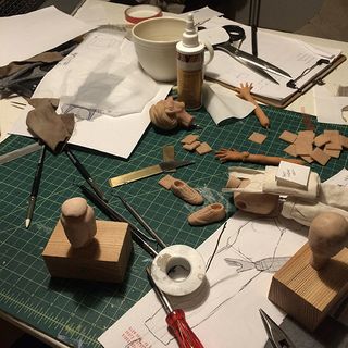Making Harold Halibut; bits of a model on a craft table