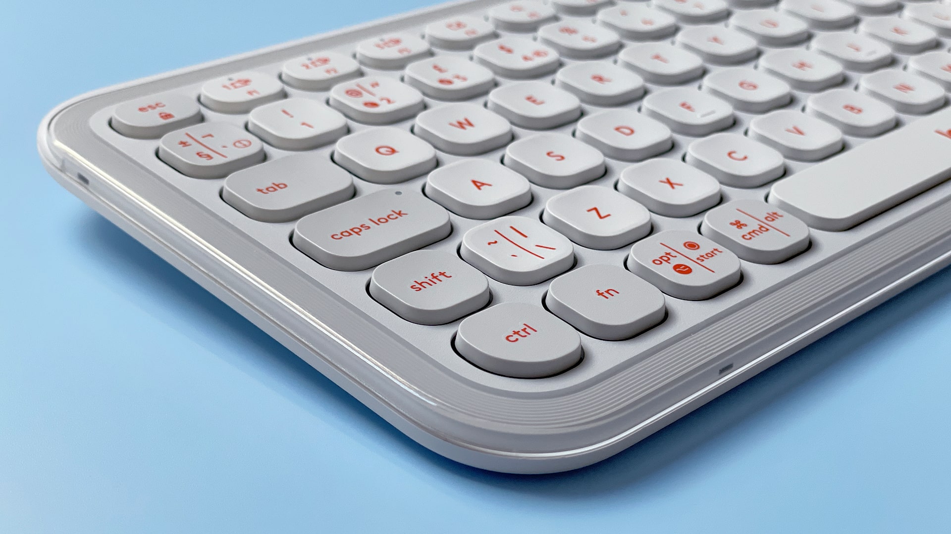 The Logitech POP Icon Keys keyboard against a blue background.