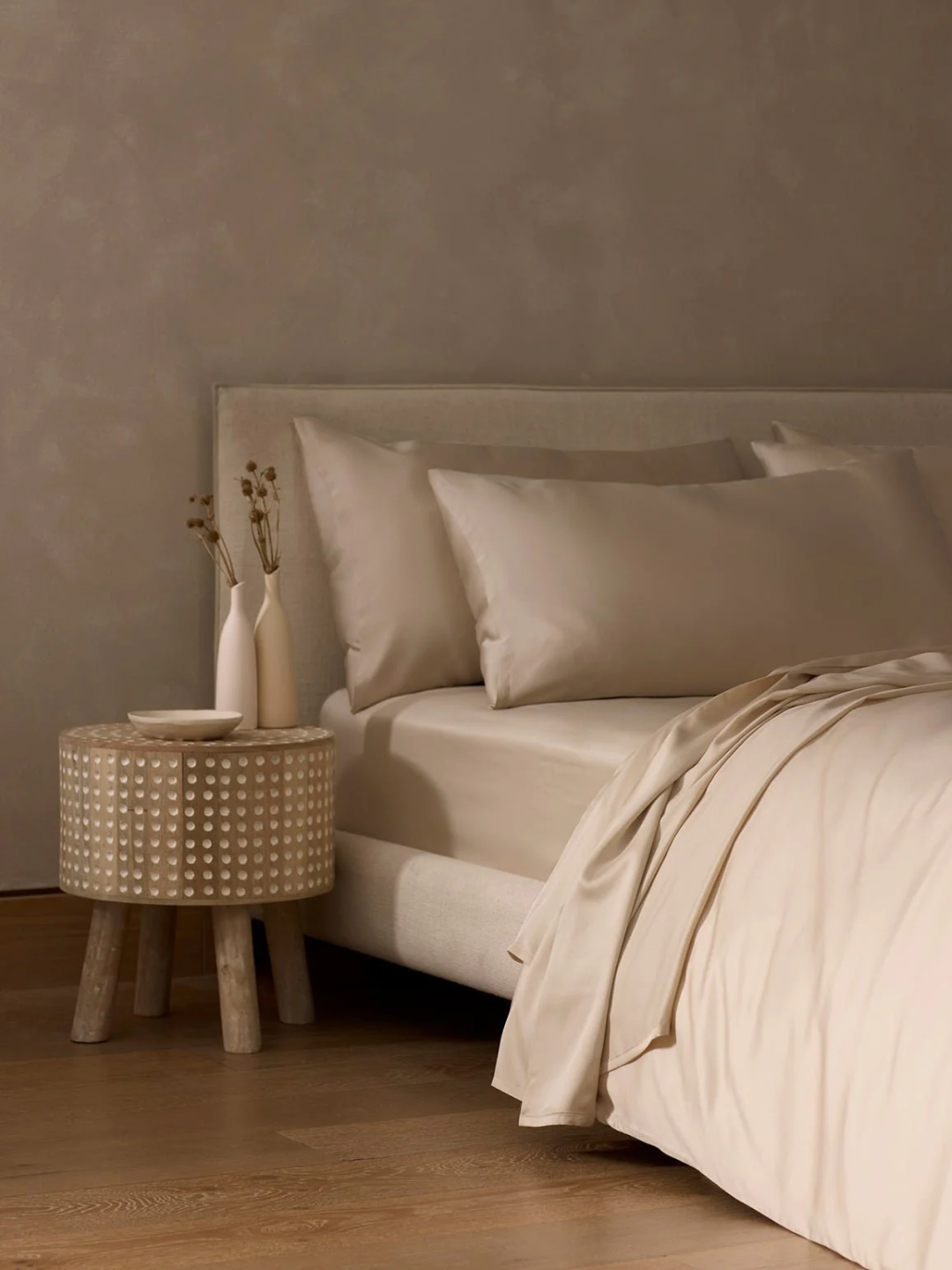 A bamboo fitted sheet from Cozy Earth on a minimalist bed