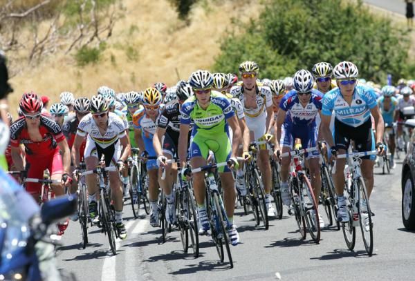 The bunch hits the steep climb.