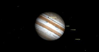 europa's black shadow crosses jupiter night sky september 2019