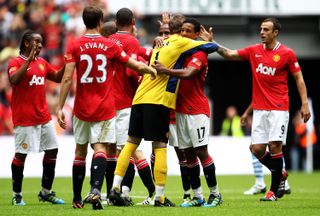 Manchester United's players celebrate their 2011 Community Shield success