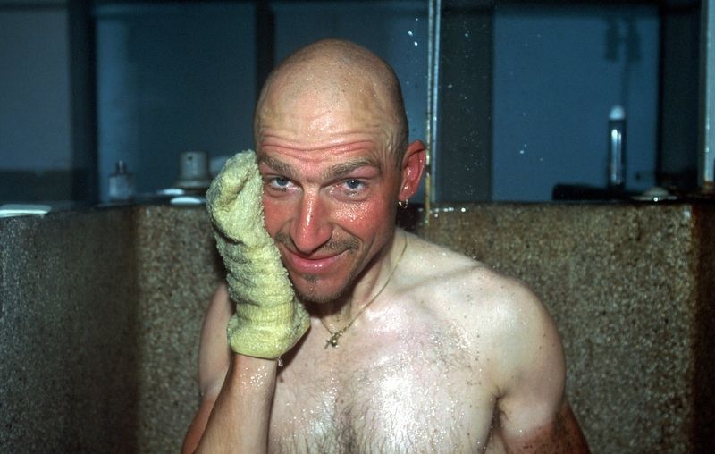 Ludo Dierckxsens scrubbing himself after the muddy 2001 Roubaix