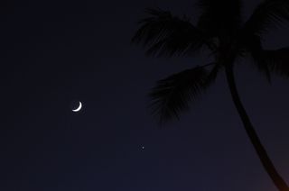 Stargazer Wayne S. of Honolulu, Hawaii, snapped this view of the moon and Venus together from Ala Moana Beach Park on Sept. 8, 2013.