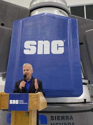 Steve Lindsey, a former astronaut and vice president of space exploration systems for Sierra Nevada, speaks at NASA's Kennedy Space Center on Nov. 19, 2019, at the unveiling of the Dream Chaser space plane's new cargo module.