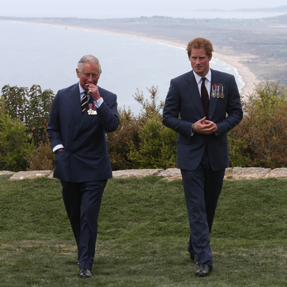 Prince Harry chats with Prince Charles, Prince of Wales
