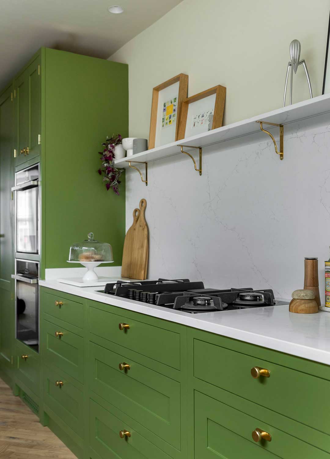 green Shaker kitchen with white worktops