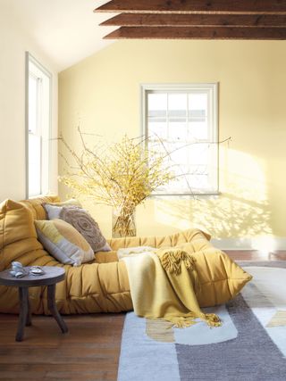 a yellow painted bedroom