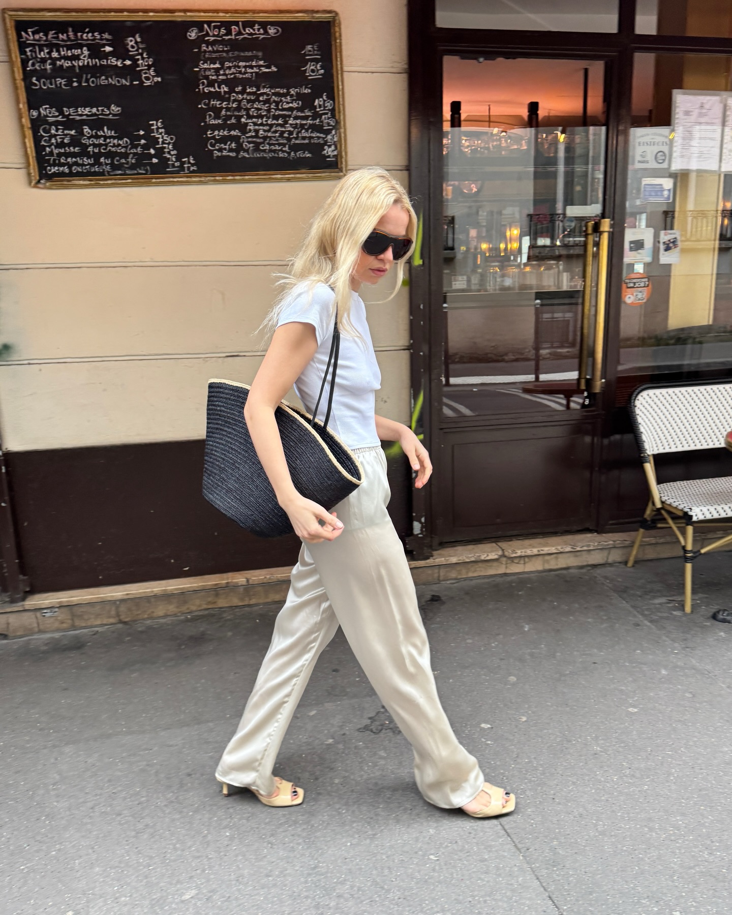 stephanie broek wears a white tshirt, silk trousers and sandals
