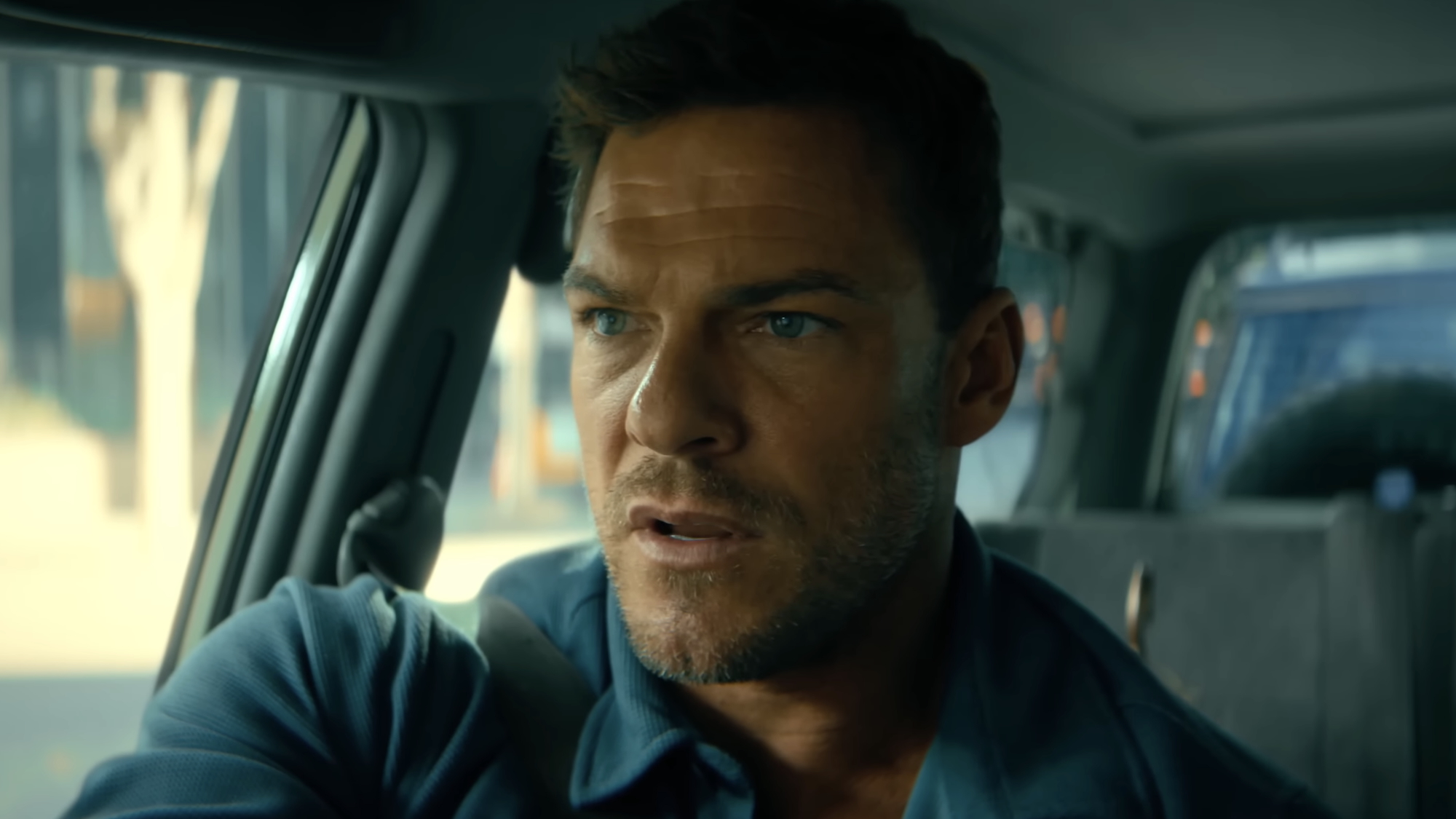 Hank Malone driving car in Runner