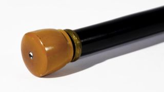 The cane has an amber-colored tip made out of plastic.