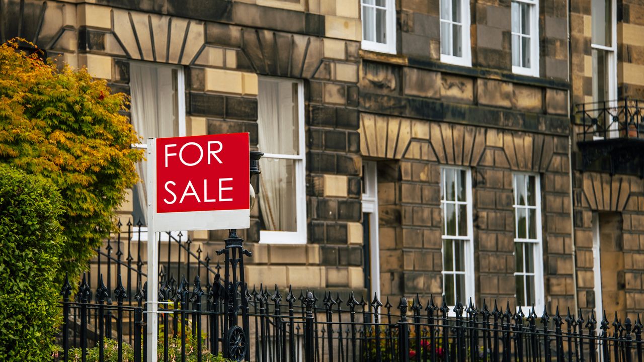 Don&#039;t do projects that could decrease your home&#039;s value: this For sale sign is outside a terraced town house