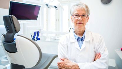 Portrait of a female mature dentist in her clinic