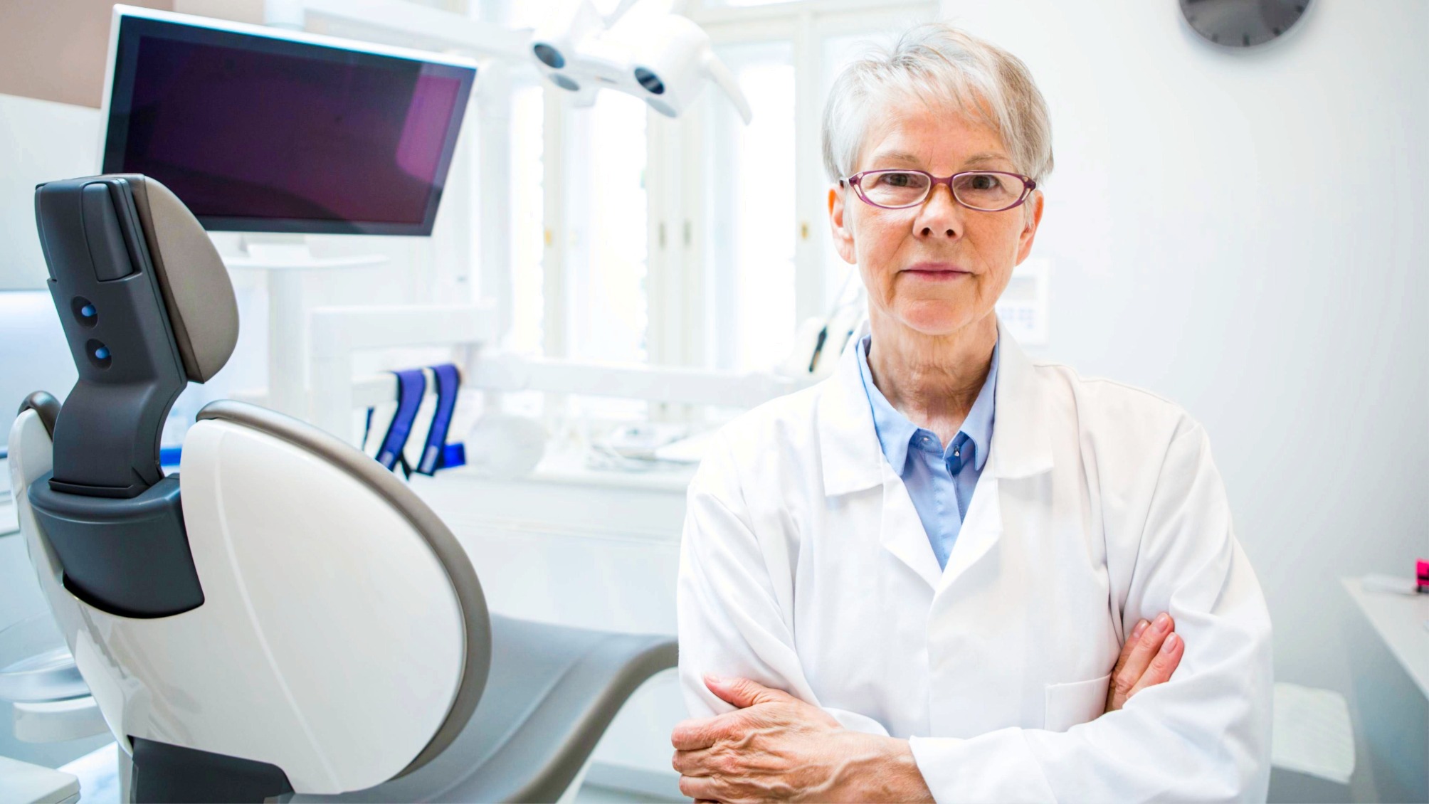 Portrait of a female mature dentist in her clinic