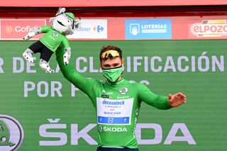 LA MANGA SPAIN AUGUST 21 Fabio Jakobsen of Netherlands and Team Deceuninck QuickStep celebrates winning the green points jersey on the podium ceremony after the 76th Tour of Spain 2021 Stage 8 a 1737 km stage from Santa Pola to La Manga del Mar Menor lavuelta LaVuelta21 on August 21 2021 in La Manga Spain Photo by Stuart FranklinGetty Images