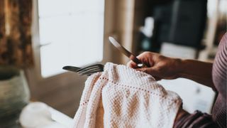 picture of woman drying off cutlery