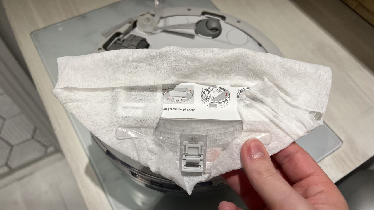 This is the mopping pad plate with a cleaning cloth attached to it