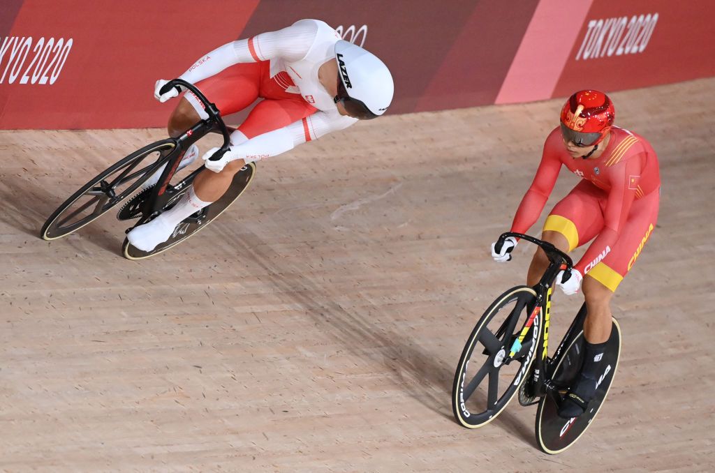 Chinas Xu Chao R and Polands Patryk Rajkowski compete in a heat of the mens track cycling sprint 132 finals during the Tokyo 2020 Olympic Games at Izu Velodrome in Izu Japan on August 4 2021 Photo by Peter PARKS AFP Photo by PETER PARKSAFP via Getty Images
