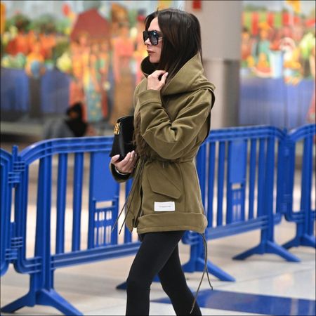 Victoria Beckham pantaboots airport