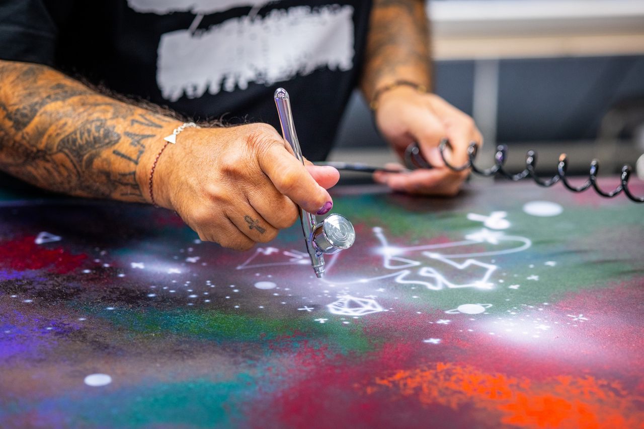 Cyril Kongo hand-painting the Starlight Headliner at Rolls-Royce