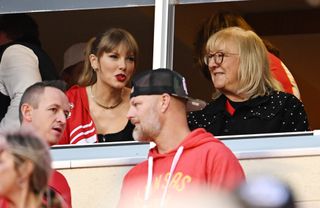 Taylor Swift and Donna Kelce, mother of Chiefs tight end Travis Kelce, watch a NFL game together.