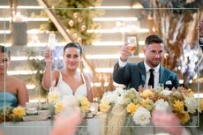 Bronte Schofield (left) and Harrison Boon (right) raising a glass of champagne during their wedding on Married at First Sight
