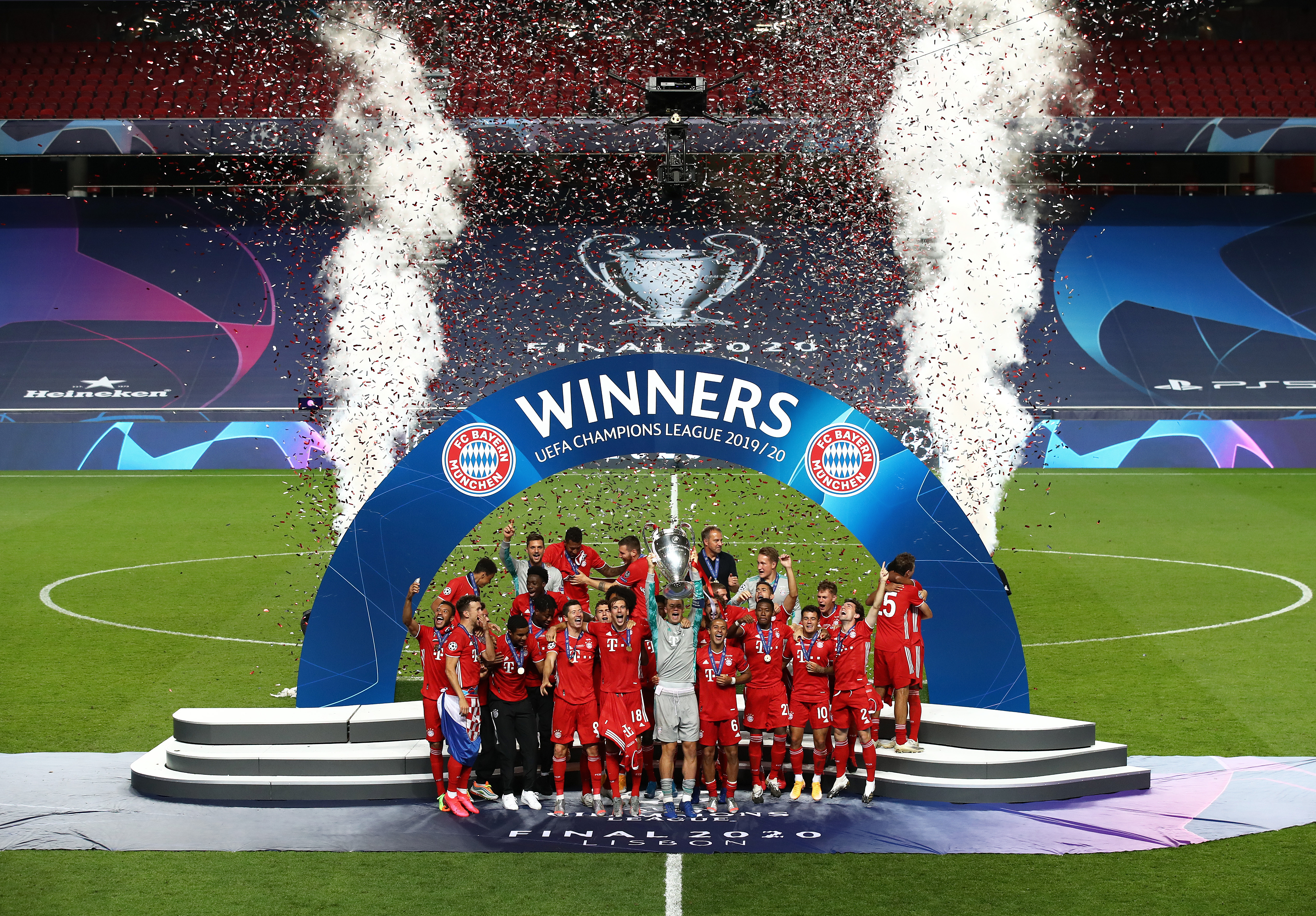 Bayern Munich players celebrate their Champions League final win over Paris Saint-Germain at an empty Estadio da Luz in Lisbon in August 2020.