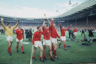 30 Jul 1966: World Cup Final, Wembley. England v West Germany (4-2 aet). England on their lap of honour with the Jules Rimet Trophy (l-r) Banks, Wilson, Ball, Charlton, Moore and Cohen. Credit: Getty/Hulton Archive