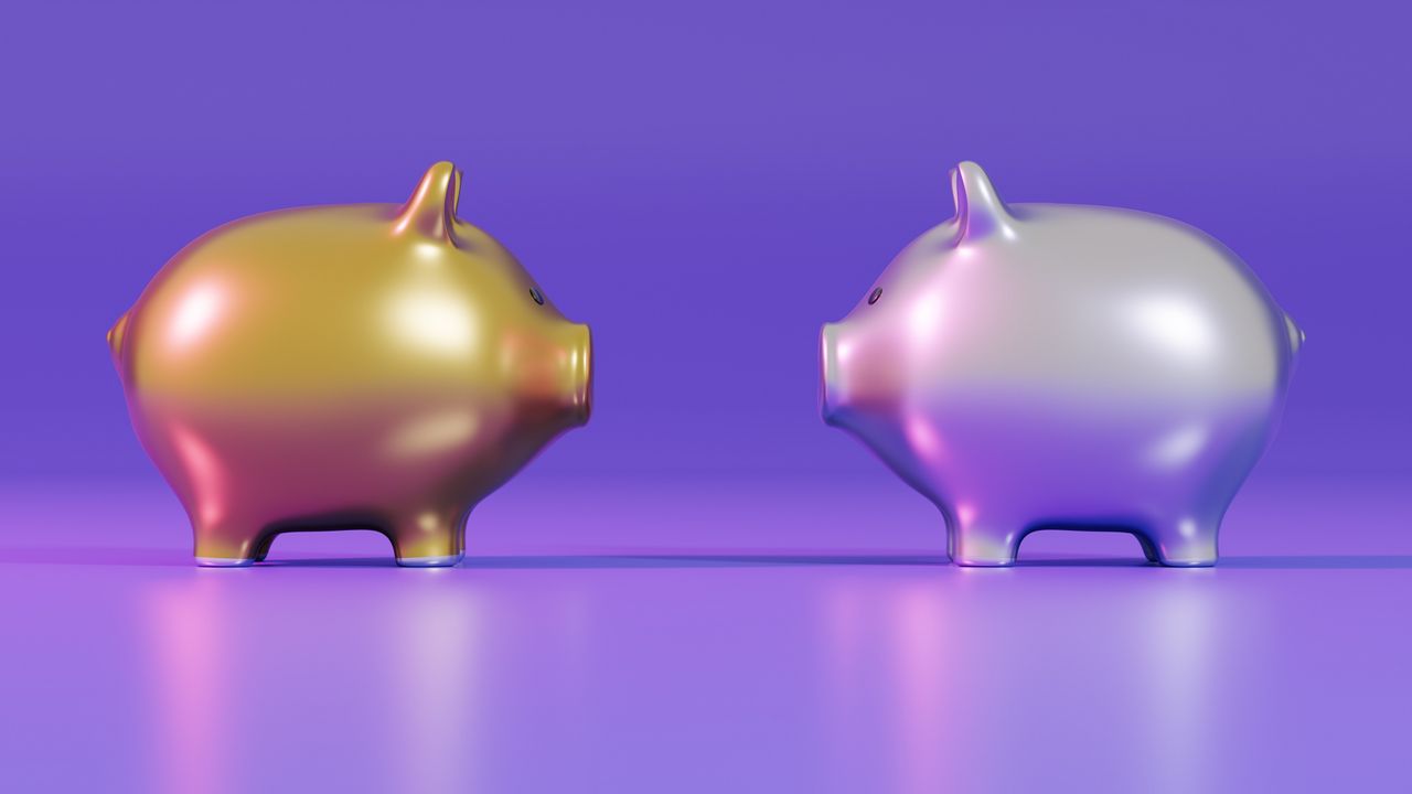 Gold and silver piggy banks facing each other against a purple background.