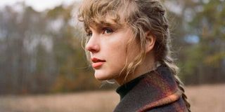 Taylor Swift posing for evermore album art