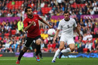 Salah Mohamed (L) of Egypt and Tommy Smith of New Zealand compete for the ball during the Men's Football first round Group C Match between Egypt and New Zealand on Day 2 of the London 2012 Olympic Games at Old Trafford on July 29, 2012 in Manchester, England. (Photo by Joern Pollex - FIFA/FIFA via Getty Images)