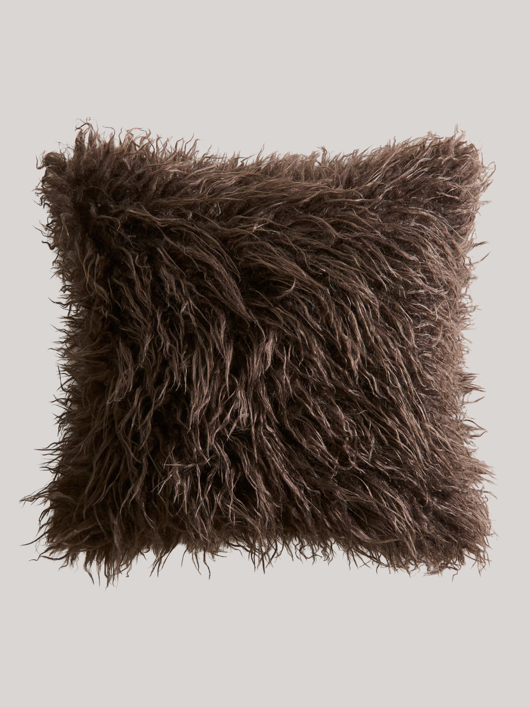 A fluffy brown pillow cover from H&amp;amp;M